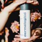 Image of hands holding Dermalogica skincare product